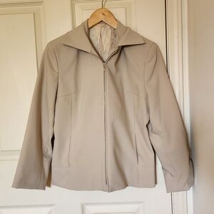 Vintage tan zip-up blazer jacket with zipper, pockets, and shoulder pads